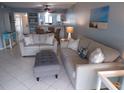 Bright living room with tile flooring, comfortable seating, and stylish decor at 1801 Gulf N Dr # 207, Bradenton Beach, FL 34217