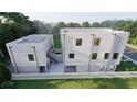 New townhome featuring a white fence, patio, and a backyard with large trees at 2146 5Th N Ave, St Petersburg, FL 33713