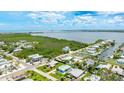 Overhead view showcasing the property's location near a waterway and lush foliage at 2713 Avenue C, Holmes Beach, FL 34217
