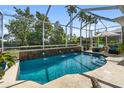 Inviting screened-in pool with three elegant water fountains, providing a luxurious outdoor retreat at 305 Siena Vista Pl, Sun City Center, FL 33573