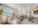 Bright and airy living room featuring modern furnishings, a large sectional couch, and lots of light at 4322 Marina View Way, Cortez, FL 34215