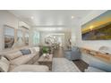 Comfortable living space featuring beach-themed decor, light colored furnishings, and an open floor plan at 4322 Marina View Way, Cortez, FL 34215