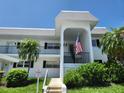 Charming two-story condo featuring a welcoming entrance and well-maintained landscaping at 4832 Independence Dr, Bradenton, FL 34210