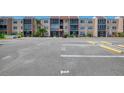 Exterior condo shot of complex showing the parking lot with reserved parking space at 519 Albee Farm Rd # 212, Venice, FL 34285