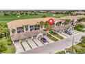 Beautiful condos feature tile roofs, multiple garages, and meticulously manicured lawns, creating an inviting neighborhood at 5528 Palmer Cir # 104, Bradenton, FL 34211