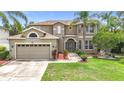 Attractive exterior view of a two-story home featuring a well-kept lawn and landscaping at 6043 44Th E Ct, Bradenton, FL 34203