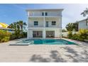 Stunning home with a large pool, spa and a spacious outdoor entertainment area at 616 Fern St, Anna Maria, FL 34216