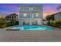 Stunning home with a large pool, spa and a spacious outdoor entertainment area at 616 Fern St, Anna Maria, FL 34216