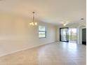 Bright living area with tile floors and golf course views, providing an inviting space for relaxation at 6509 Grand Estuary Trl # 201, Bradenton, FL 34212