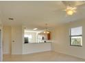 Open living space with tile flooring, connecting to a kitchen area and offering a comfortable layout at 6509 Grand Estuary Trl # 201, Bradenton, FL 34212