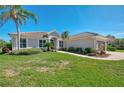 Charming single-story home featuring beautiful landscaping, a tile roof, and well-maintained lawns at 7302 Dunes Ct, Bradenton, FL 34202