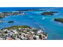 Scenic aerial view showcasing the waterfront homes nestled along the beautiful Florida coast and its waterways at 795 Marbury Ln, Longboat Key, FL 34228