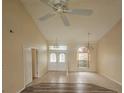 Spacious living room with high ceilings and abundant natural light, creating a welcoming atmosphere at 9926 Gulfstream Blvd, Englewood, FL 34224