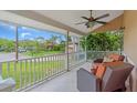 Cozy porch provides seating and views of the outdoors, with a ceiling fan for added comfort at 1461 Marlin St, Nokomis, FL 34275