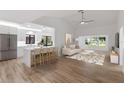 Bright, open-concept living room and kitchen with modern decor and ample natural light at 1684 Pintail Way, Sarasota, FL 34231