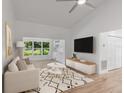 Stylish living room featuring a vaulted ceiling, modern furnishings, and large bright windows at 1684 Pintail Way, Sarasota, FL 34231