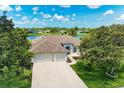 Charming single-story home with a well-maintained lawn, mature trees and a three car garage at 208 147Th Ne St, Bradenton, FL 34212