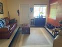 Inviting living room with large windows offering natural light and a cozy atmosphere at 2115 Temple St, Sarasota, FL 34239