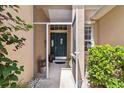 Eye-level front door showcasing the home's entrance, with a screened doorway and beautiful green door at 315 36Th Ne St, Bradenton, FL 34208