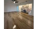 Spacious living room boasts modern flooring and a unique brick fireplace, perfect for relaxation and entertaining at 3429 37Th N St, St Petersburg, FL 33713