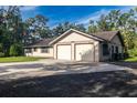 Attractive home featuring an attached two-car garage and a well-maintained lawn at 3804 65Th E St, Bradenton, FL 34208
