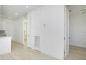 Hallway with access to other rooms features luxury vinyl plank flooring at 4796 Duncan Rd, Punta Gorda, FL 33982