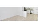 Modern kitchen featuring white cabinets, stainless steel appliances, and stone countertops at 4796 Duncan Rd, Punta Gorda, FL 33982