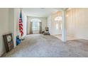 View of the living room with a large arched window and a double door entryway at 4915 Bookelia Cir, Bradenton, FL 34203