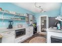 Bright kitchen features open shelving, stainless steel appliances, and modern countertops at 509 Pine Ave # A, Anna Maria, FL 34216