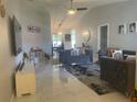 Bright and airy living room with high ceilings, modern furnishings, and elegant marble flooring at 5848 Milton Ave, Sarasota, FL 34243