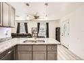 Bright kitchen with granite countertops and stainless steel sink at 718 17Th E St, Bradenton, FL 34208