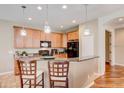 Eat-in kitchen features granite counters, pendant lights, and stainless appliances at 8168 Villa Grande Ct, Sarasota, FL 34243