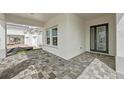 Welcoming front entrance features beautiful pavers and a stylish door, leading into this lovely home at 10309 Longmeadow Ave, Parrish, FL 34219