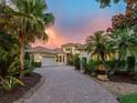 Beautiful home with mature tropical landscaping, brick drive and a tile roof at 12448 Highfield Cir, Lakewood Ranch, FL 34202