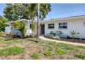 Beautiful home with a manicured lawn and a charming walkway leading to the entrance at 1400 62Nd S Pl, St Petersburg, FL 33705