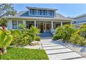 Charming two-story home with landscaped yard and inviting front porch at 1523 1St W Ave, Bradenton, FL 34205