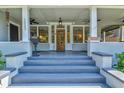 Inviting front porch with ceiling fans and classic architectural details at 1523 1St W Ave, Bradenton, FL 34205