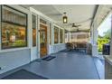 Cozy front porch with ample seating, perfect for relaxing outdoors at 1523 1St W Ave, Bradenton, FL 34205