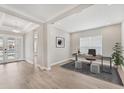 Bright home office features a desk, modern decor, light wood floors, and lots of natural light at 15813 San Lazzaro Ave, Bradenton, FL 34211