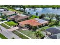 Well-maintained single-Gathering home with a tile roof and pristine landscaping in a quiet neighborhood at 1677 Fleetwood Dr, Sarasota, FL 34232