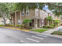 Corner lot townhome featuring manicured landscaping and easy street access at 2553 Harn Blvd # 1, Clearwater, FL 33764