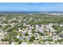 Panoramic aerial shot showcasing the neighborhood, nearby greenery, and the home's proximity to water at 2866 E Rainbow Cir, Sarasota, FL 34231