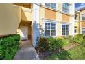 Well-maintained exterior entrance, vibrant landscaping, and convenient access to units at 3005 Chianti Ct # 103, Sarasota, FL 34237