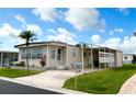 Inviting home with a covered carport, well-kept lawn, and charming exterior details, perfect for comfortable living at 3224 Aspen Ter, Sarasota, FL 34237