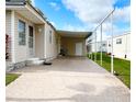 Spacious covered patio area adjacent to a well-maintained home, offering ample space for outdoor entertaining and relaxation at 3224 Aspen Ter, Sarasota, FL 34237