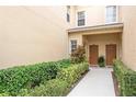 Close up of a front entrance featuring dual doors, landscaping, and a walkway at 3698 Parkridge Cir # 26-104, Sarasota, FL 34243