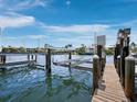 Private boat dock with lifts, ready for boating and enjoying waterfront living at 3959 Somerset Dr, Sarasota, FL 34242