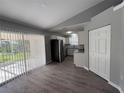A kitchen area featuring stainless steel appliances and sliding door access to the yard at 4031 Wake Ave, Sarasota, FL 34241