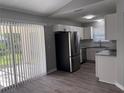 Kitchen area featuring stainless steel appliances, bright white cabinets, and modern fixtures at 4031 Wake Ave, Sarasota, FL 34241
