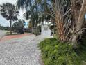 Cozy home with mature landscaping and a gravel yard, nestled in a quiet community at 4845 Boca Raton Ave, Sarasota, FL 34234